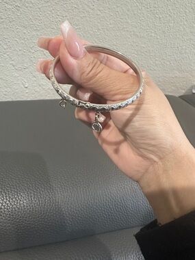 18k white gold bangle with charm